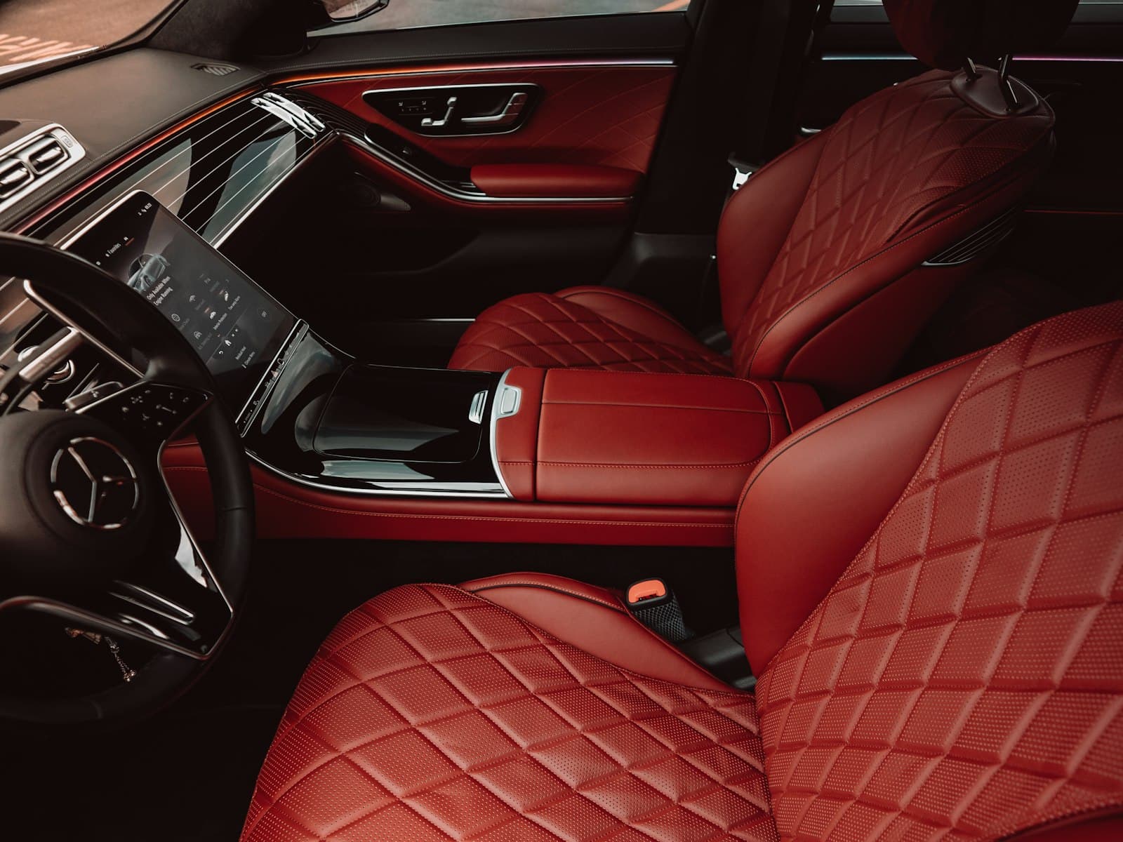 A cabin trimmed in red diamond-stitched leather