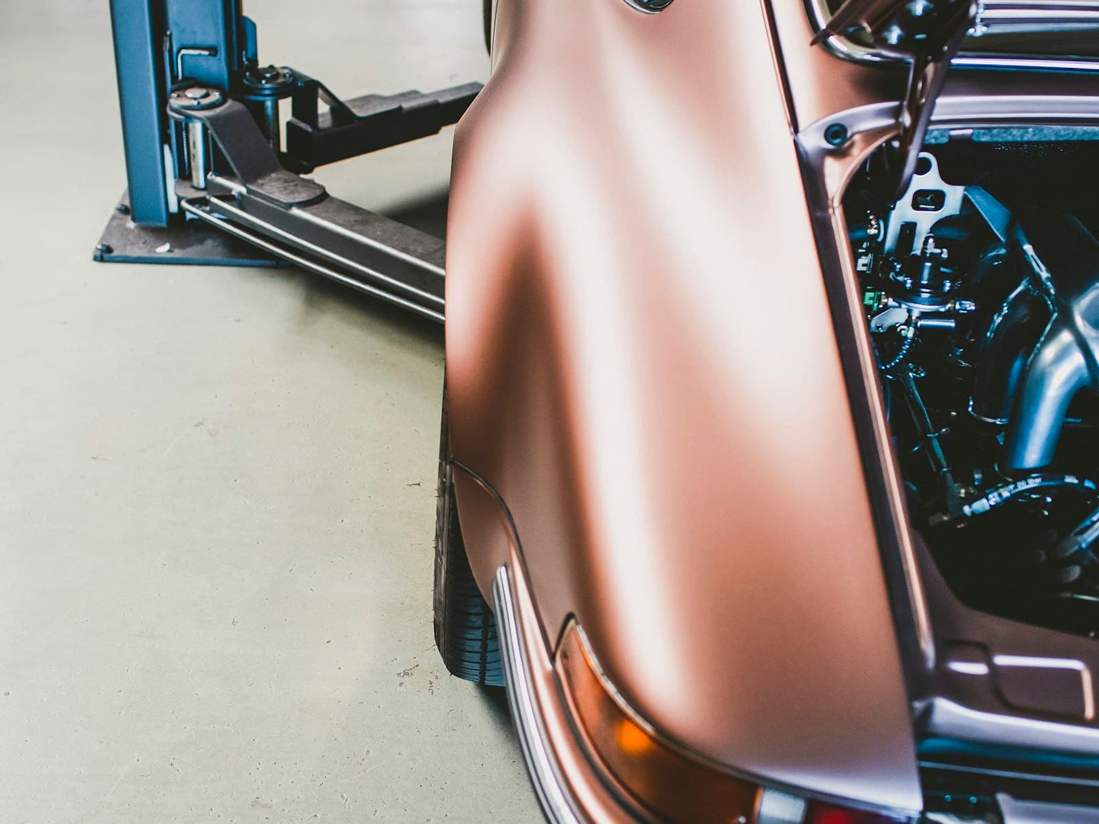 A car raised on a workshop lift
