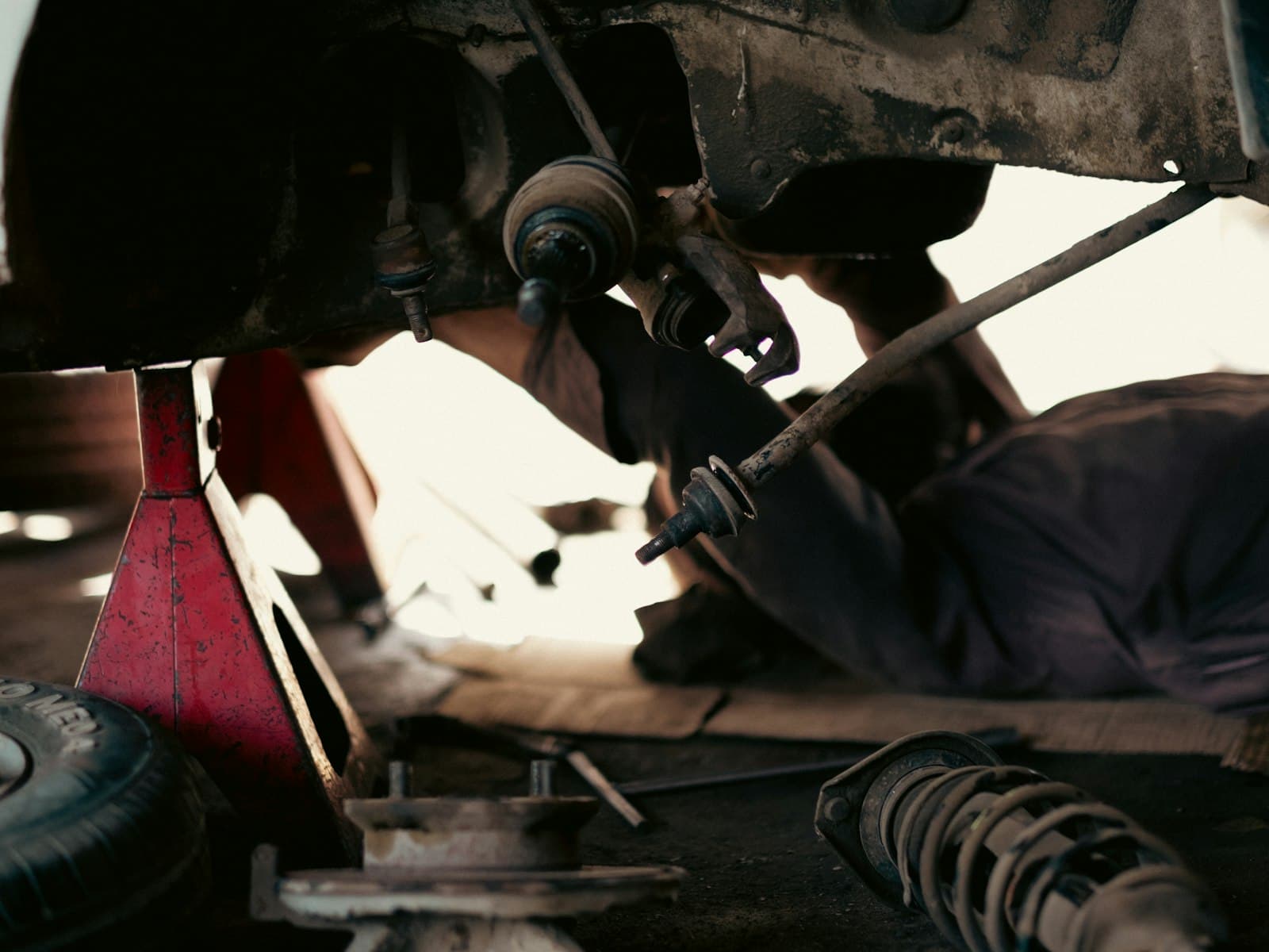 Suspension and brake work on a raised car