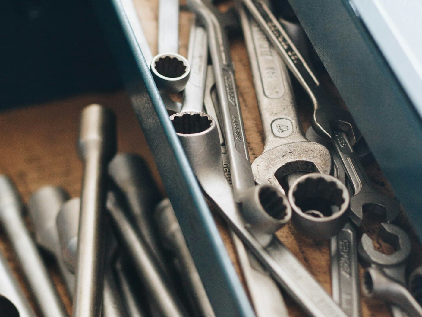 A tray of spanners and sockets on a workbench